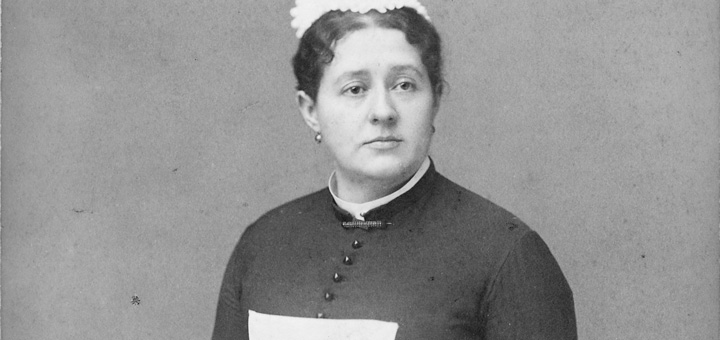 Unidentified woman in maid's uniform. Date on photo, 1884. U.S. National Archives and Records Administration via Wikimedia